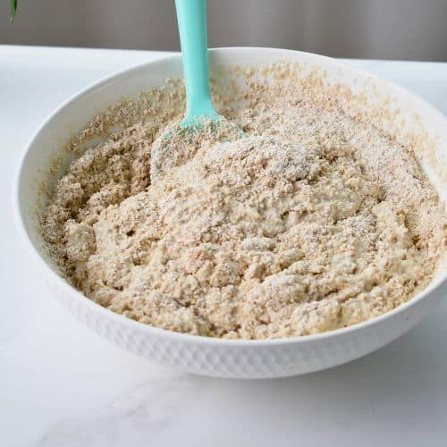 Mixing Quinoa Bread ingredients in a bowl.