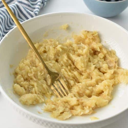 Mashed banana in a bowl.