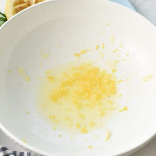Mixing liquid ingredients with lemon zest.