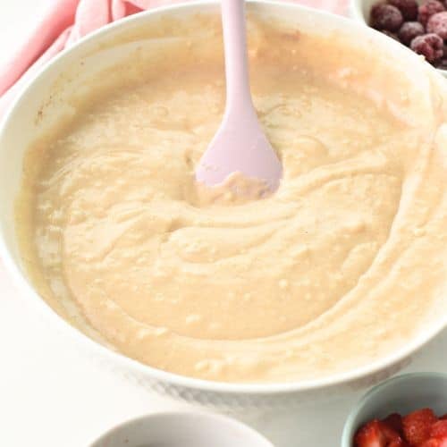 Mixing the liquid batter together.