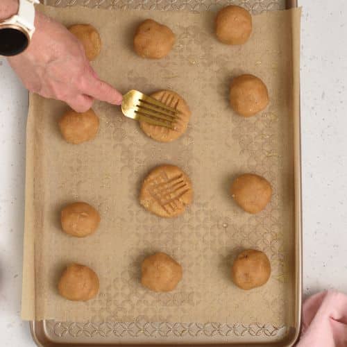 Forming cookies before baking the pan.