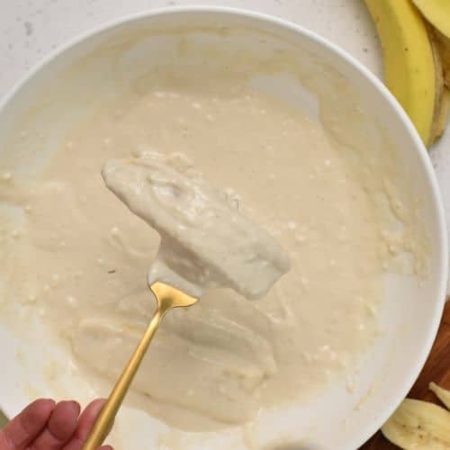 Dipped banana slice in the batter.