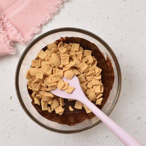 Adding cereal to melted chocolate