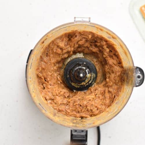 Butter and date puree in the food processor.