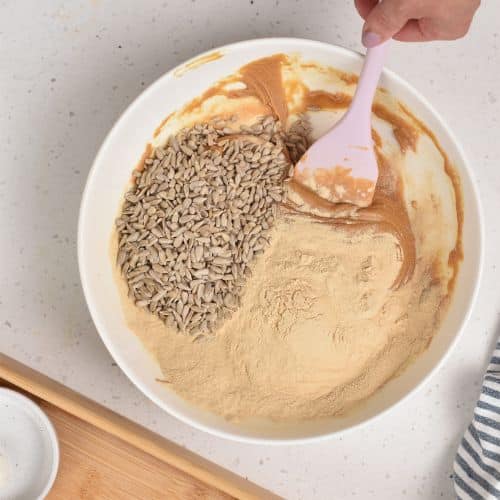 Adding protein power and seeds to the Homemade Protein Bars base.