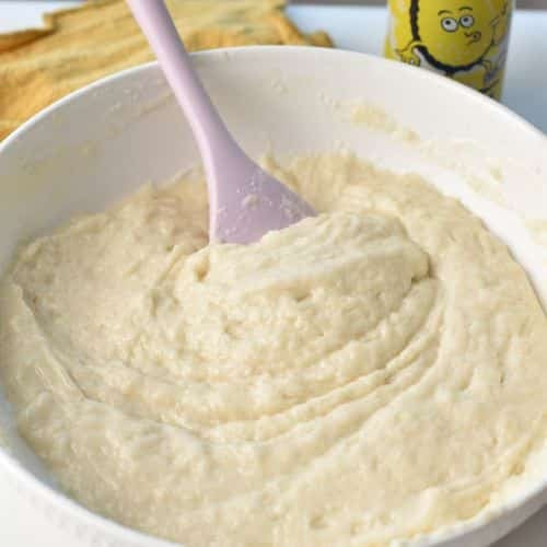 Lemonade Cake batter stirred in a mixing bowl.