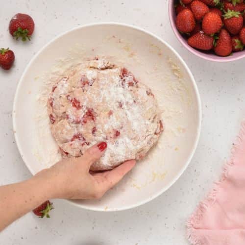 Forming a Strawberry Scone dough disc in a bowl.