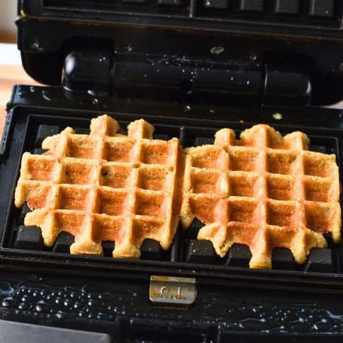 Cooking the Banana Oatmeal Waffles in the waffle iron.