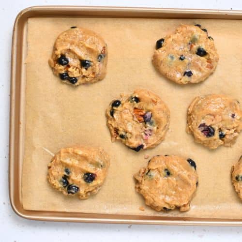Blueberry Banana Cookies ready to bake on a cookie sheet.