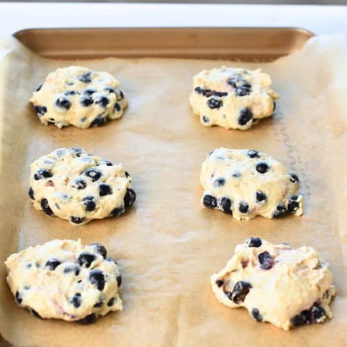 Blueberry Muffin Cookies ready to bake on a sheet.