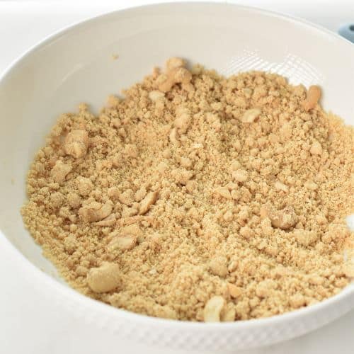 Ground cashews in a mixing bowl,