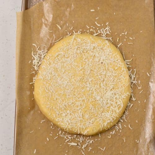 Coconut Scone dough disc on a baking sheet.