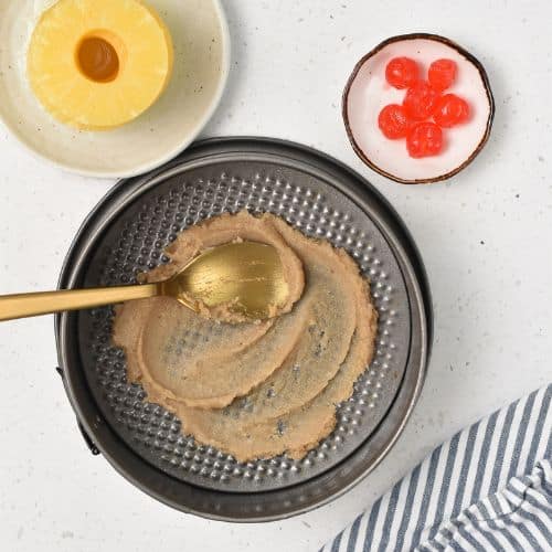 Sugar mixture spread in in a pan.