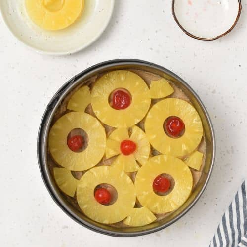 Base of Easy Pineapple Upside Down Cake in a springform pan.