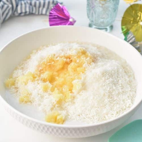 Pineapple Coconut Cake batter ingredients in a bowl.