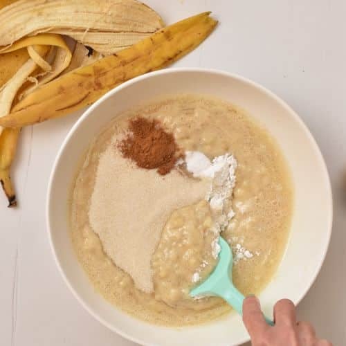 Adding dry ingredients to the Banana Bread Chocolate Chips Muffin batter.