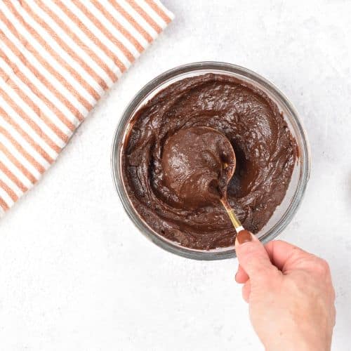 Spoon in the Healthy Chocolate Frosting.