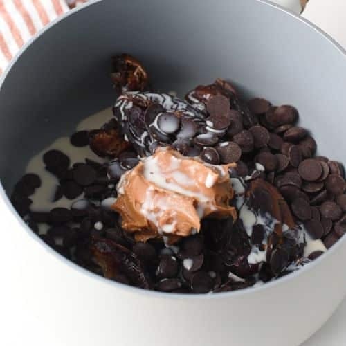 Healthy Chocolate Frosting ingredients in a saucepan.