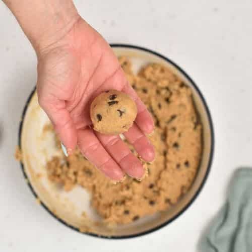 Rolling Peanut Butter Cookie Dough into balls.