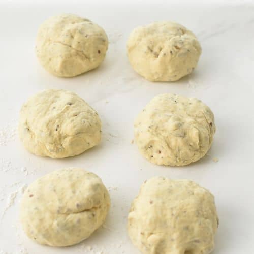 Protein Bagel dough balls on a benchtop.