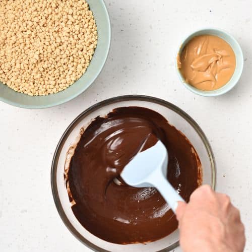Melting chocolate with coconut oil in a bowl.