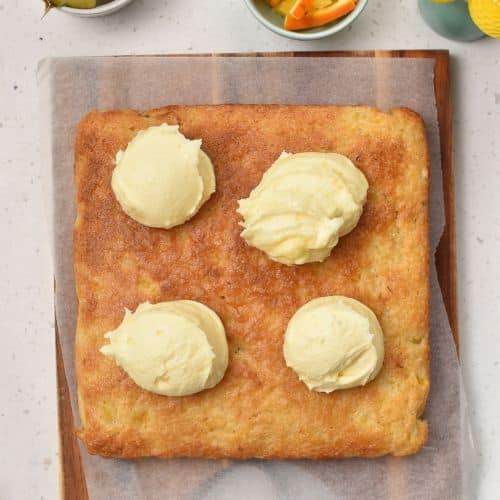 Spreading frosting on Orange Pineapple Cake.