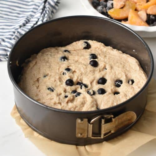 Peach Blueberry Cake batter in a springform pan.