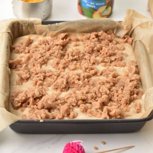 Peach Coffee Cake batter and crumble in a pan.