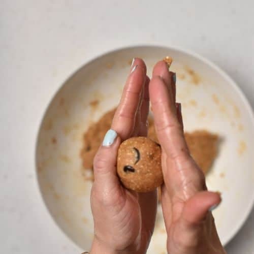 Rolling Peanut Butter Protein Balls in my hands.