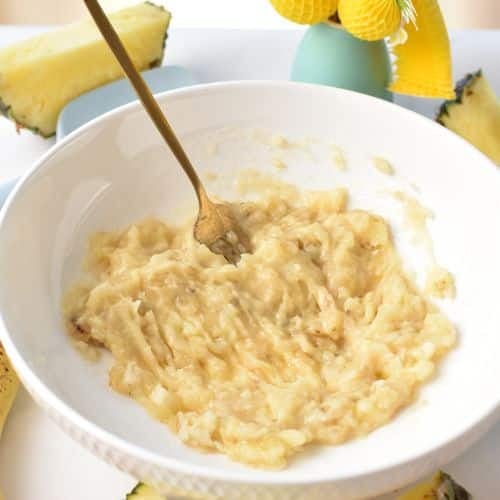 mashed bananas in a mixing bowl.