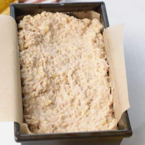 Quinoa Banana Bread batter in a pan ready to bake.