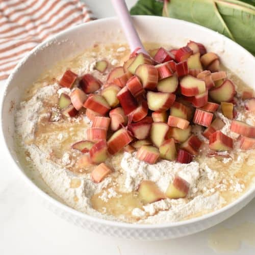 Adding rhubarb dice to the cake dough.