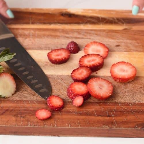Slicing strawberries.