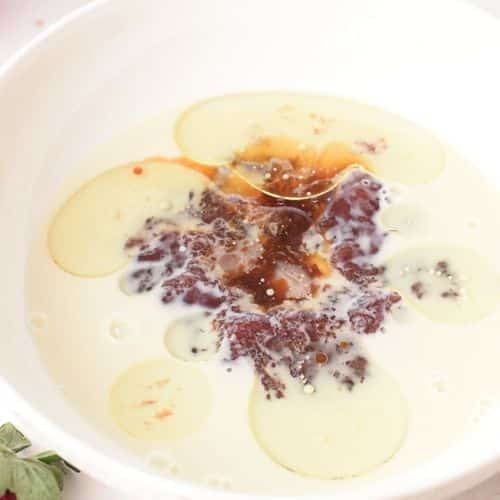 Liquid Strawberry Jam Cake ingredients in a bowl.