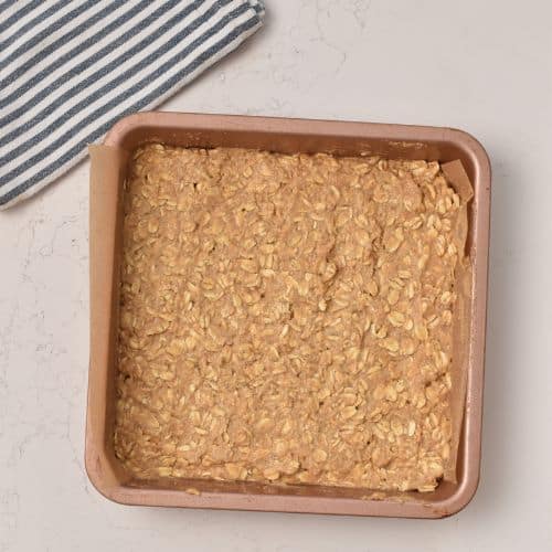 Applesauce Oatmeal Bars in a pan ready to bake.