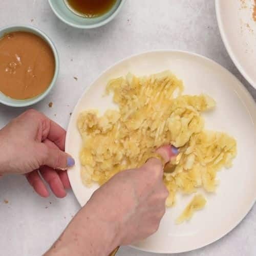 Mashing bananas in a bowl