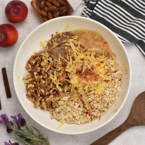 Adding apples to Apple Granola mixture.